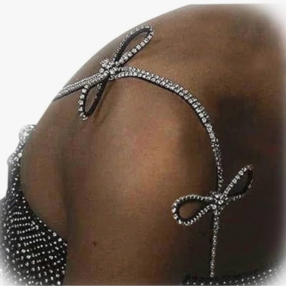 Adjustable rhinestone bra straps with bows.